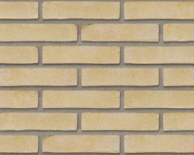 waalformaat steenstrips geel op een muur binnenshuis