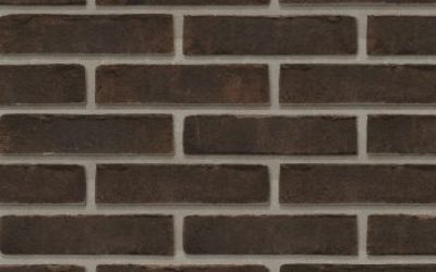 waalformaat metselstenen bruin gemetseld in horizontale lijnen op een muur